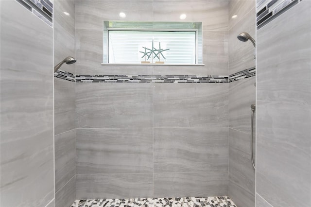 bathroom with a tile shower