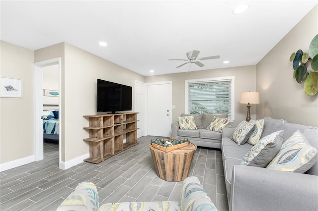 living area with wood tiled floor, baseboards, ceiling fan, and recessed lighting