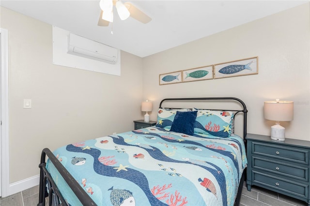 bedroom with baseboards, a ceiling fan, and a wall mounted air conditioner