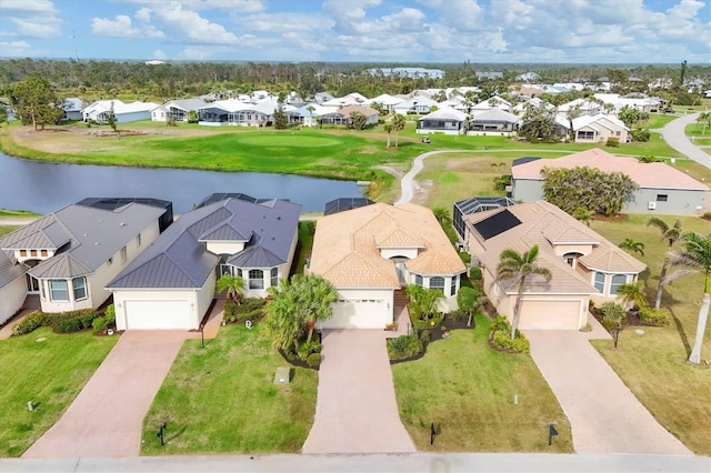 drone / aerial view with a water view and a residential view