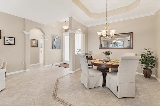 dining area featuring light tile patterned floors, decorative columns, arched walkways, baseboards, and a tray ceiling