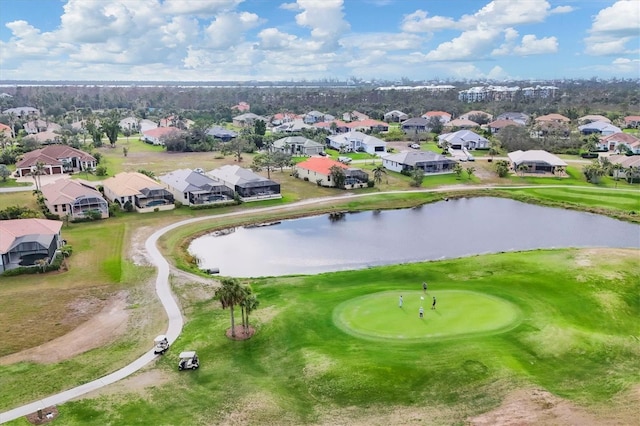 aerial view with a water view, a residential view, and golf course view