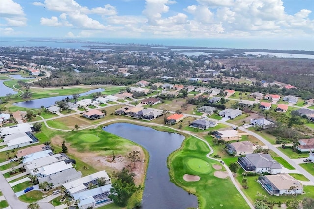 birds eye view of property with a water view, view of golf course, and a residential view