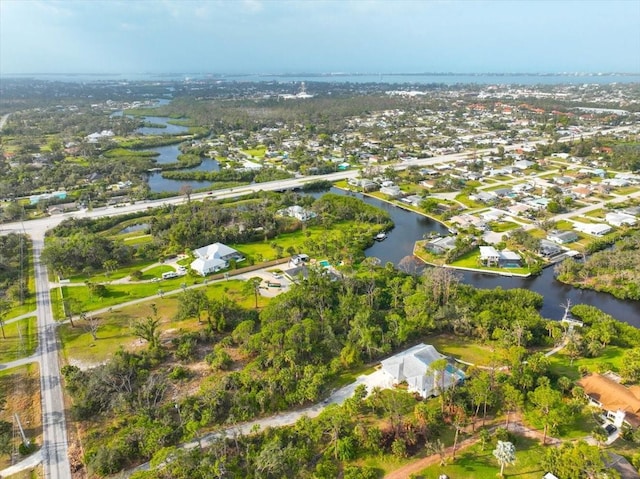 birds eye view of property featuring a water view and a residential view