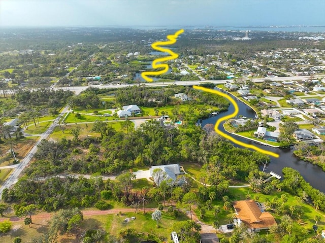 birds eye view of property with a residential view and a water view