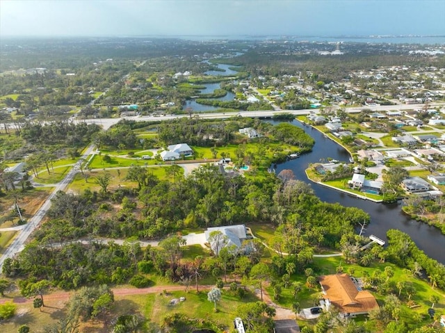 drone / aerial view featuring a water view and a residential view