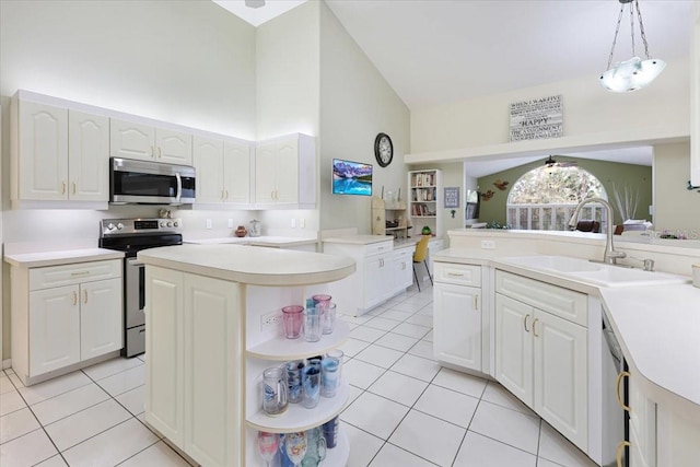 kitchen featuring light tile patterned floors, stainless steel appliances, white cabinetry, open shelves, and a sink