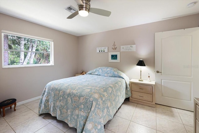 bedroom featuring baseboards, visible vents, a ceiling fan, and light tile patterned flooring