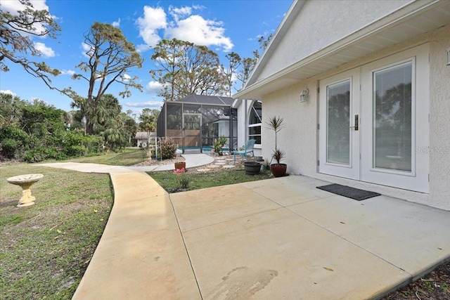 view of patio / terrace featuring a lanai