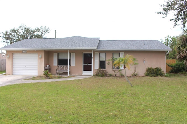 single story home featuring a garage, driveway, a front lawn, and stucco siding