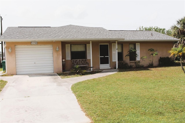 single story home with a garage, driveway, a front yard, and stucco siding