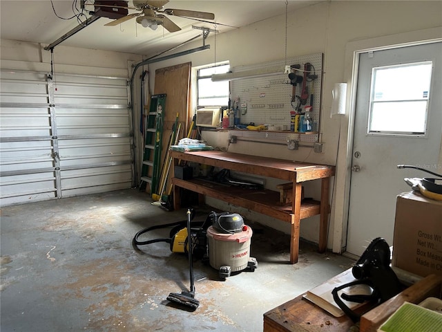 garage with a workshop area and a garage door opener