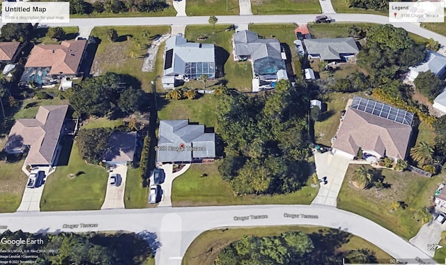 birds eye view of property with a residential view