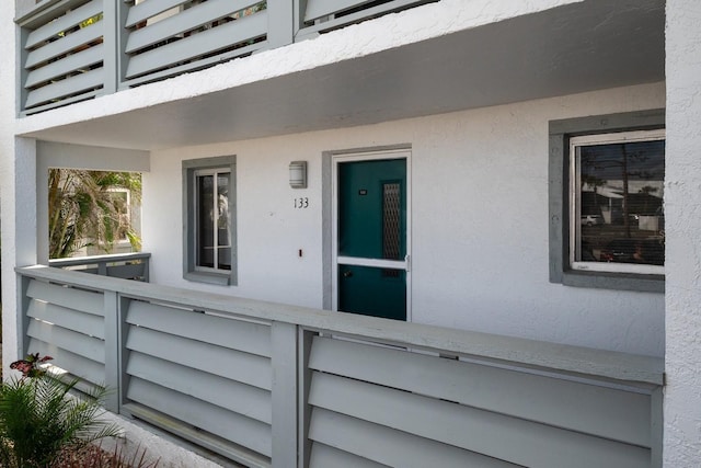 doorway to property featuring a balcony