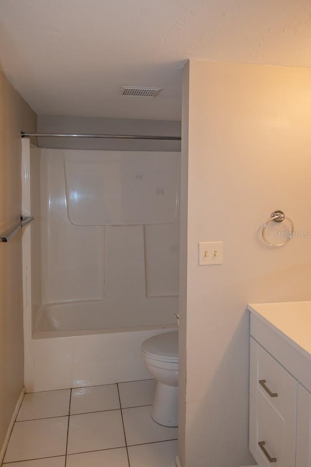 bathroom with bathtub / shower combination, visible vents, toilet, vanity, and tile patterned flooring