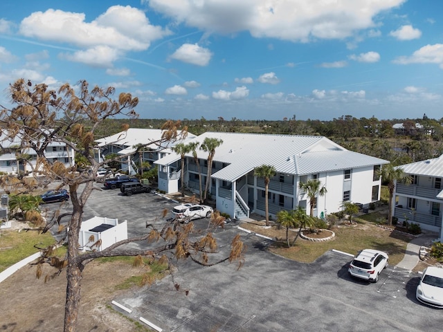 exterior space featuring a residential view and metal roof