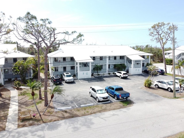 view of property featuring uncovered parking