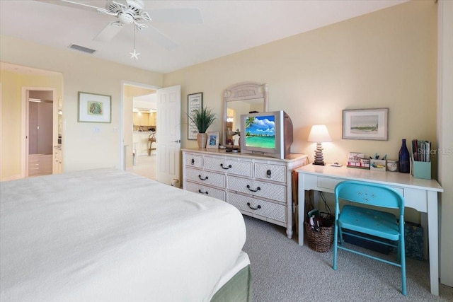 bedroom with carpet floors, visible vents, and a ceiling fan