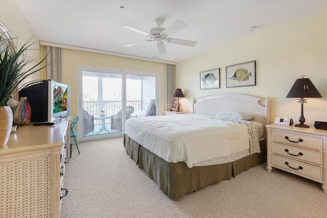 bedroom featuring light carpet, a ceiling fan, and access to exterior