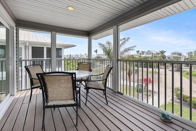 deck with outdoor dining area