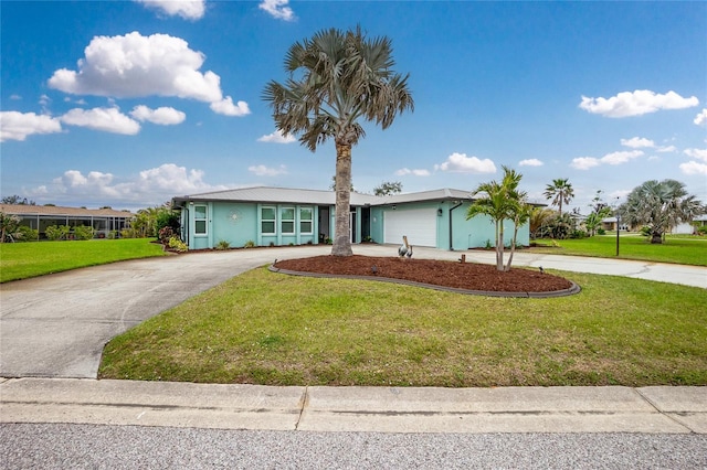 view of front of property with driveway, an attached garage, and a front lawn