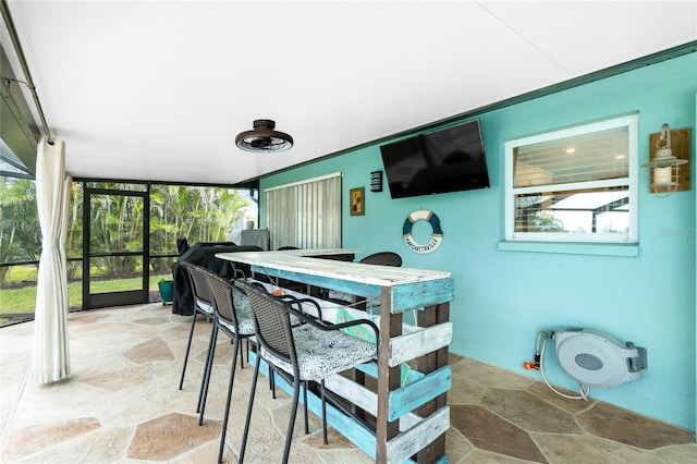 sunroom / solarium featuring plenty of natural light