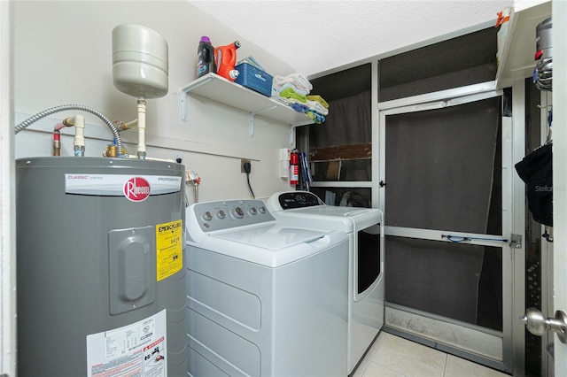 washroom featuring laundry area, independent washer and dryer, tile patterned flooring, and electric water heater