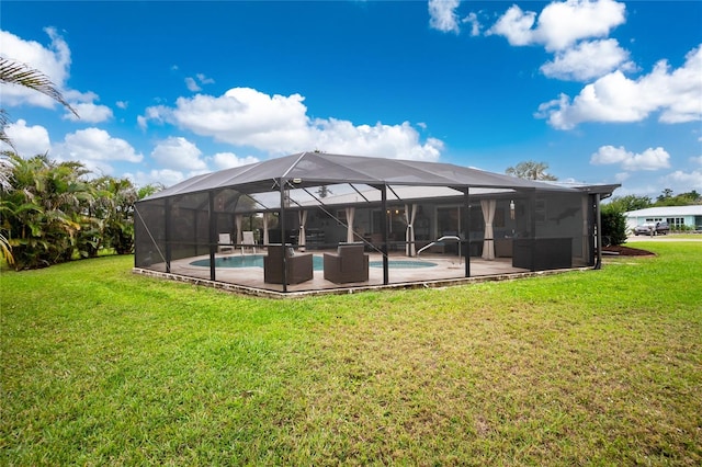 back of house featuring a lawn, a lanai, and an outdoor pool