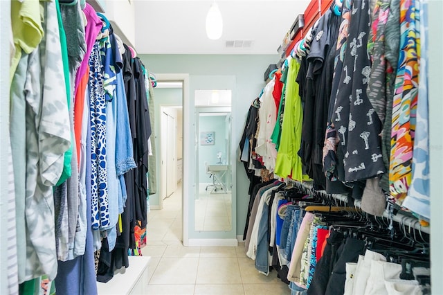 walk in closet featuring tile patterned flooring and visible vents