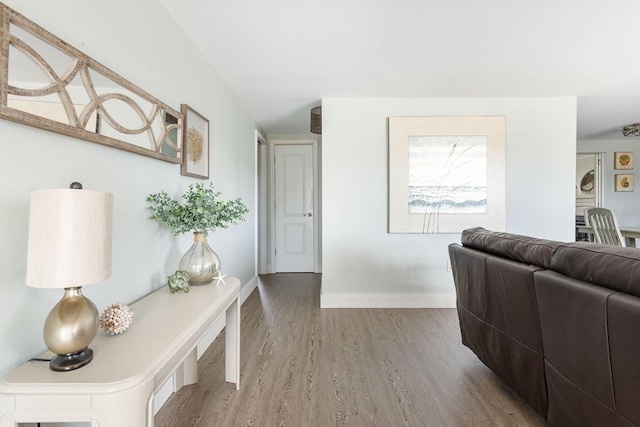 interior space with wood finished floors and baseboards