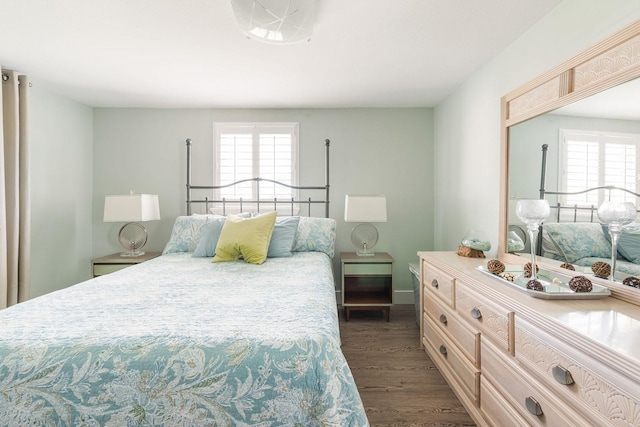 bedroom with dark wood-style floors