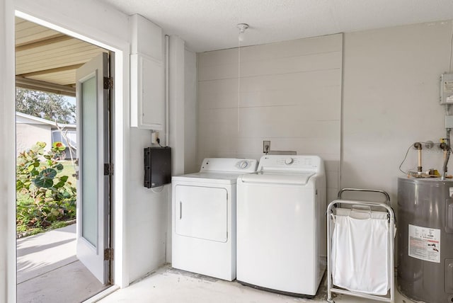 laundry area with a textured ceiling, laundry area, independent washer and dryer, and electric water heater