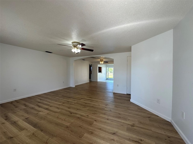192 Garden Ave NW, Port Charlotte, FL 33952 - unfurnished room with a textured ceiling, wood finished floors, visible vents, and baseboards