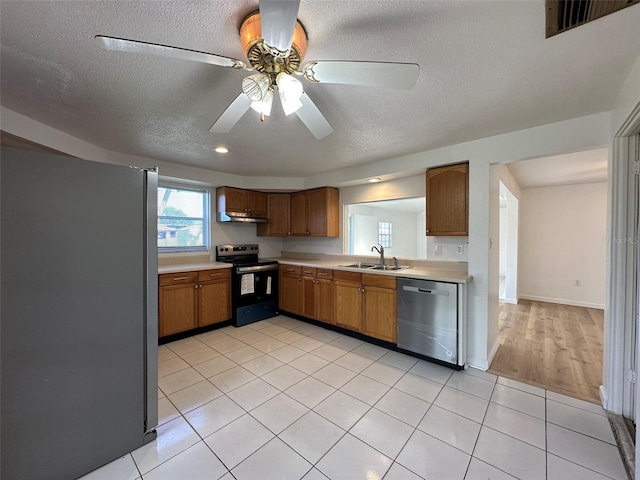 192 Garden Ave NW, Port Charlotte, FL 33952 - kitchen featuring visible vents, stainless steel appliances, light countertops, under cabinet range hood, and a sink