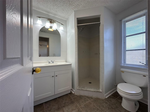 192 Garden Ave NW, Port Charlotte, FL 33952 - bathroom featuring a textured ceiling, toilet, vanity, a shower stall, and tile patterned floors