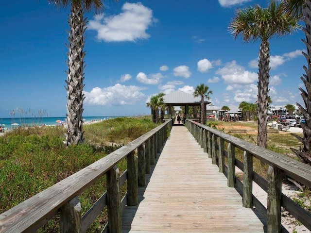 view of dock with a water view and a gazebo