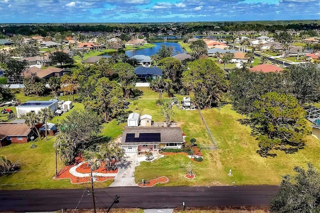 bird's eye view featuring a water view and a residential view