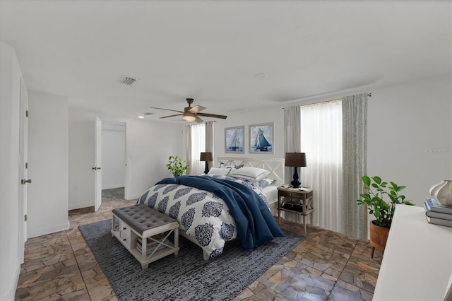 840 E 7th St, Englewood, FL 34223 - bedroom featuring ceiling fan and light stone finish floors