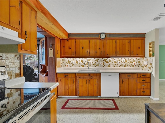 kitchen featuring stainless steel electric range oven, visible vents, brown cabinetry, white dishwasher, and a sink