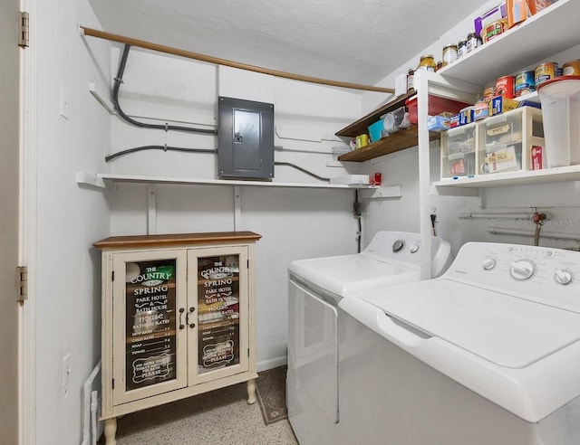 laundry room featuring washing machine and dryer, laundry area, and electric panel