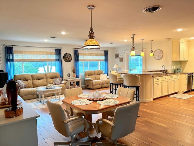 dining area featuring light wood-type flooring, visible vents, and recessed lighting