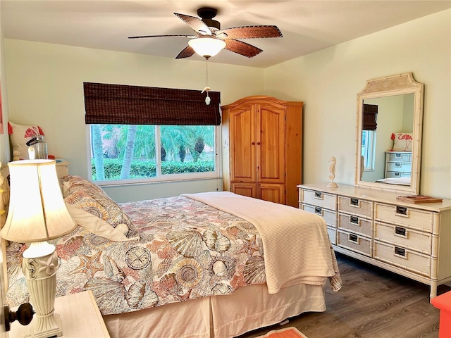 bedroom featuring dark wood finished floors and a ceiling fan