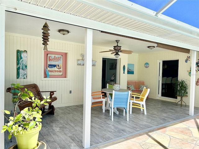 view of patio with outdoor dining space and ceiling fan