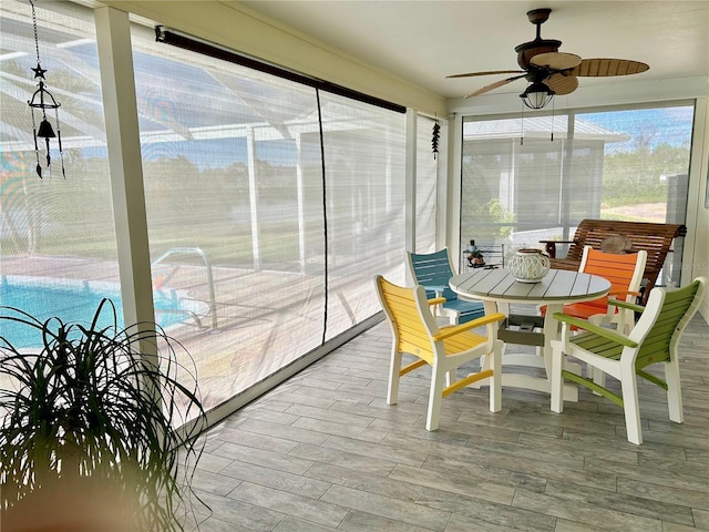 sunroom / solarium with ceiling fan