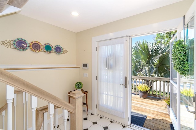 entryway with stairway and tile patterned floors