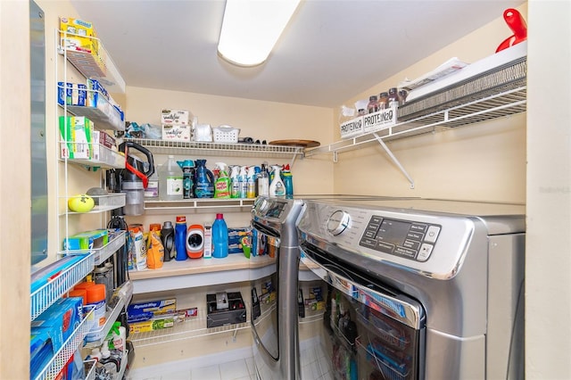 laundry area featuring laundry area, independent washer and dryer, and tile patterned flooring