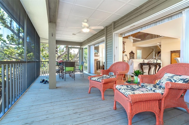 sunroom with a ceiling fan