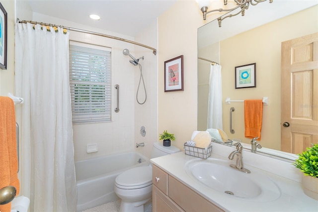 full bathroom featuring toilet, shower / tub combo with curtain, and vanity