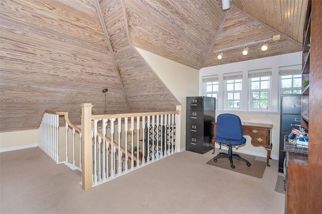 carpeted office space featuring lofted ceiling, wooden ceiling, and baseboards