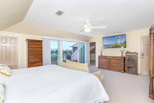 carpeted bedroom with access to exterior, lofted ceiling, visible vents, and a ceiling fan